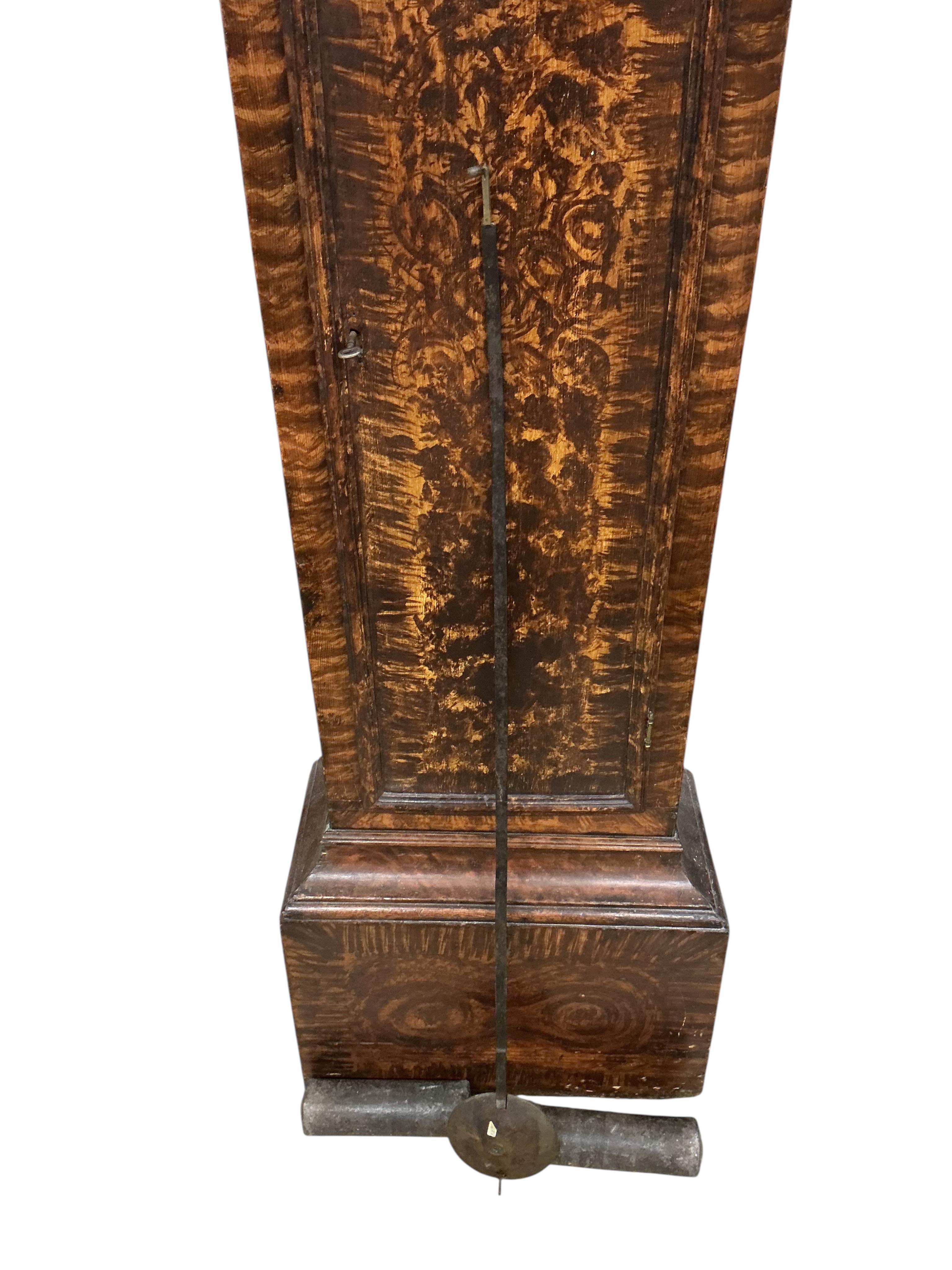 A George III simulated mulberry eight day longcase clock, the arched brass dial with strike silent and subsidiary seconds dial, date aperture, signed Moore, Ipswich, height 240cm